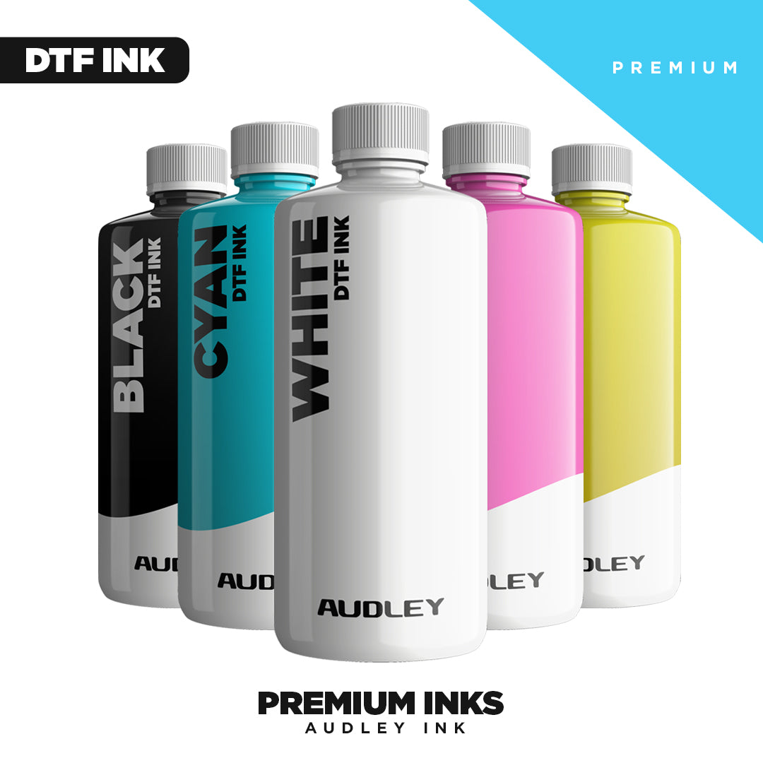 Five bottles of Audley DTF ink in black, cyan, white, magenta, and yellow, arranged in a row with "PREMIUM INKS AUDLEY INK" text below.