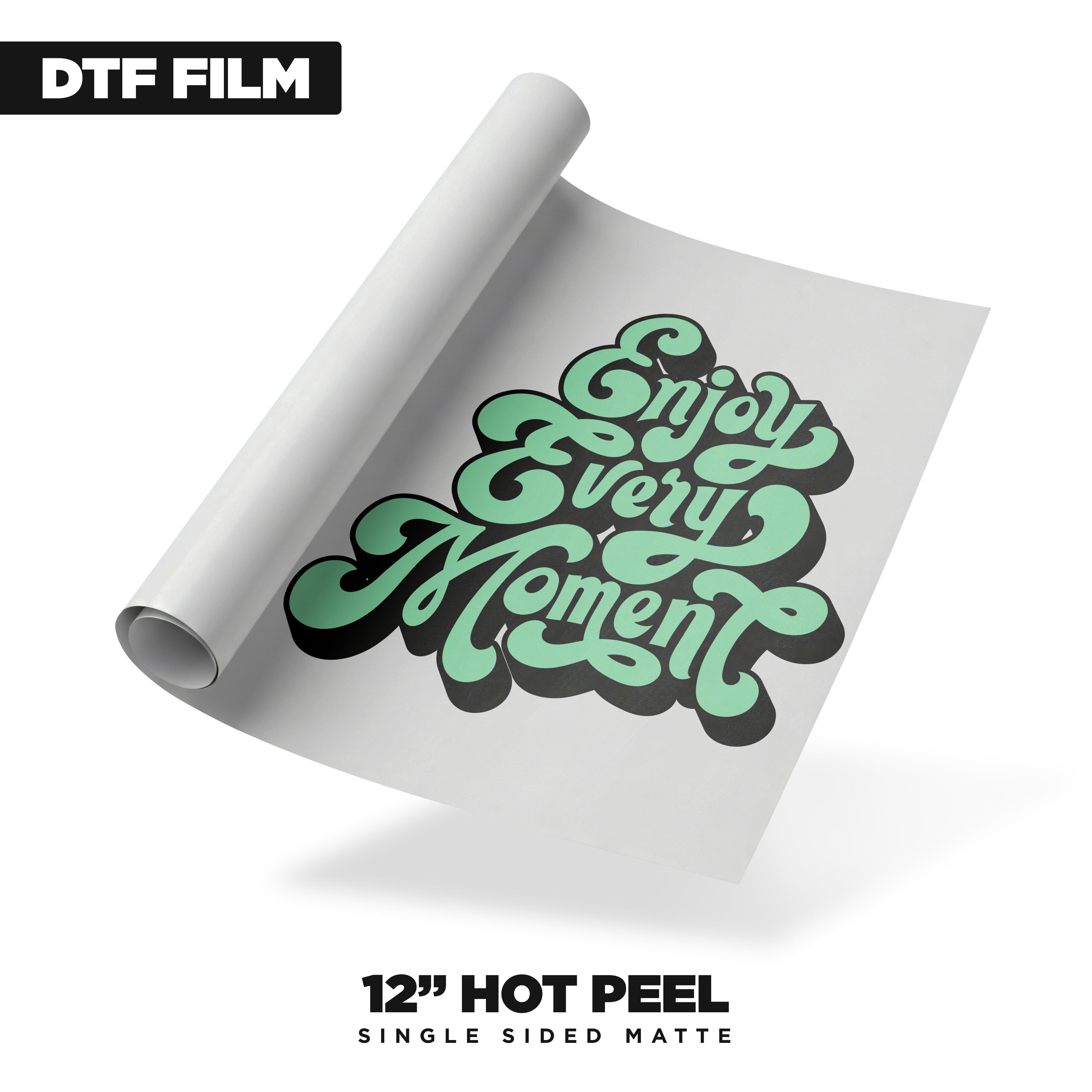 A sheet of DTF Locker’s 12in Hot Peel DTF Film - Single Side Matte displays “Enjoy Every Moment” in bold mint green and black letters, with "12'' HOT PEEL SINGLE SIDED MATTE" shown below.
