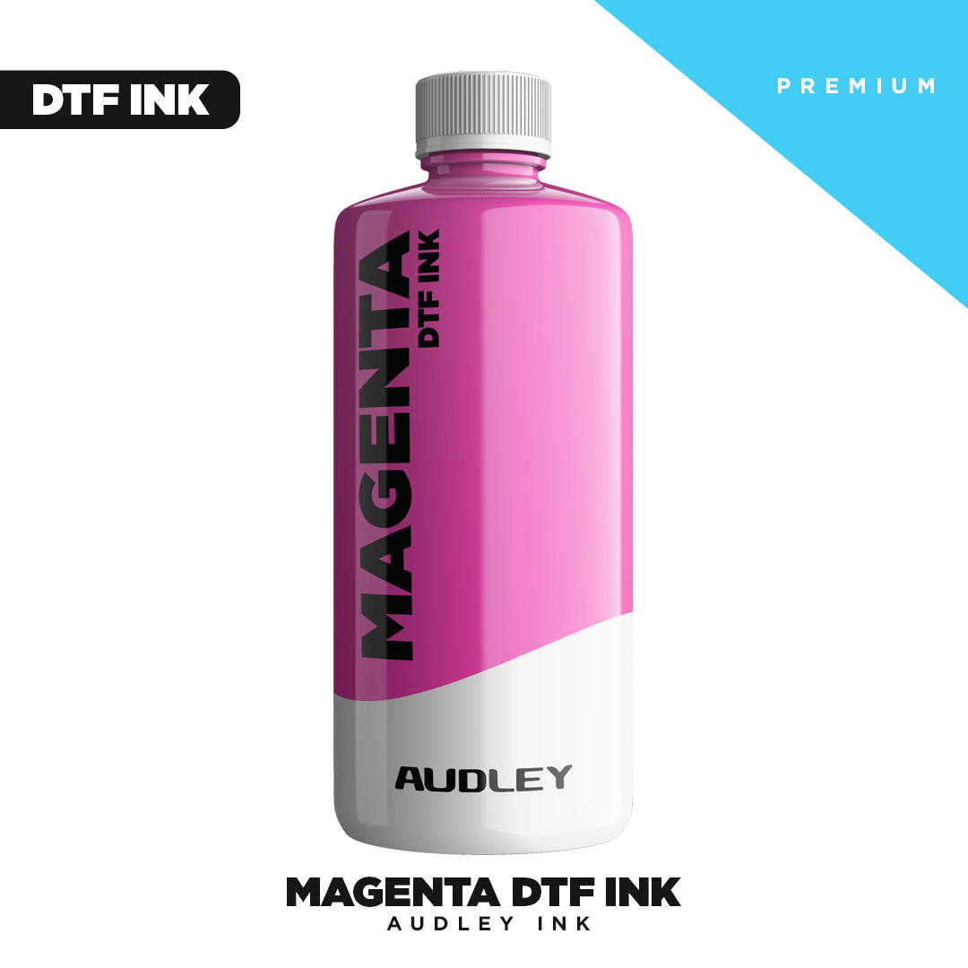 A bottle of Premium Magenta DTF INK from DTF Locker sits on a white background, labeled "MAGENTA DTF INK" and featuring "DTF INK" and "PREMIUM" in black and blue boxes—ideal for vibrant Direct to Film printing.