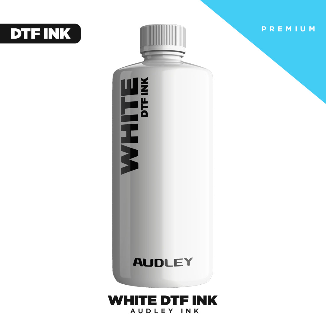 A white bottle labeled "Premium White DTF INK" from DTF Locker, designed for Direct to Film printing. The mostly white background has a blue triangle marked "PREMIUM," with bold text highlighting high-opacity White DTF Ink.