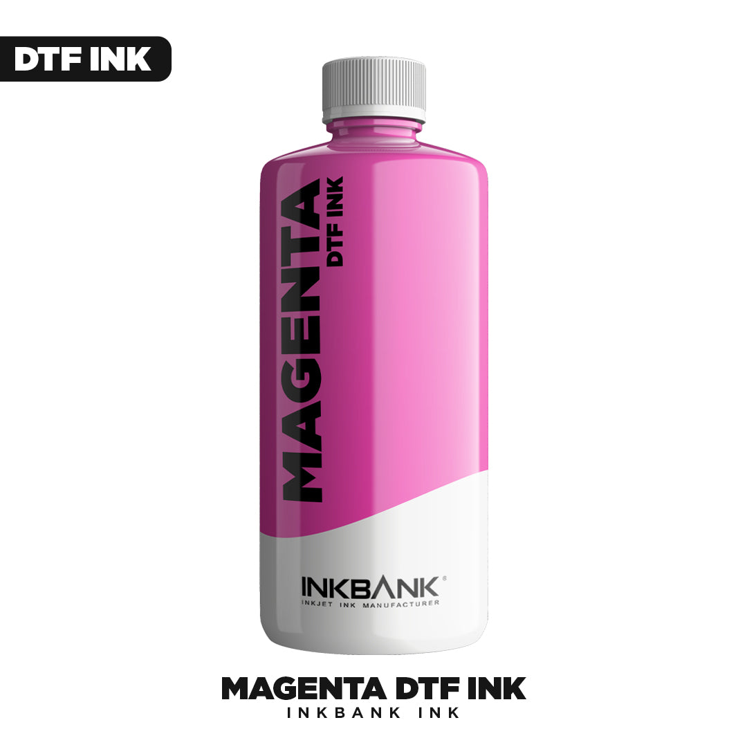 A bottle of Inkbank Magenta DTF INK by DTF Locker stands upright with a gray cap. Its label fades from magenta to white, making it perfect for direct to film printing.