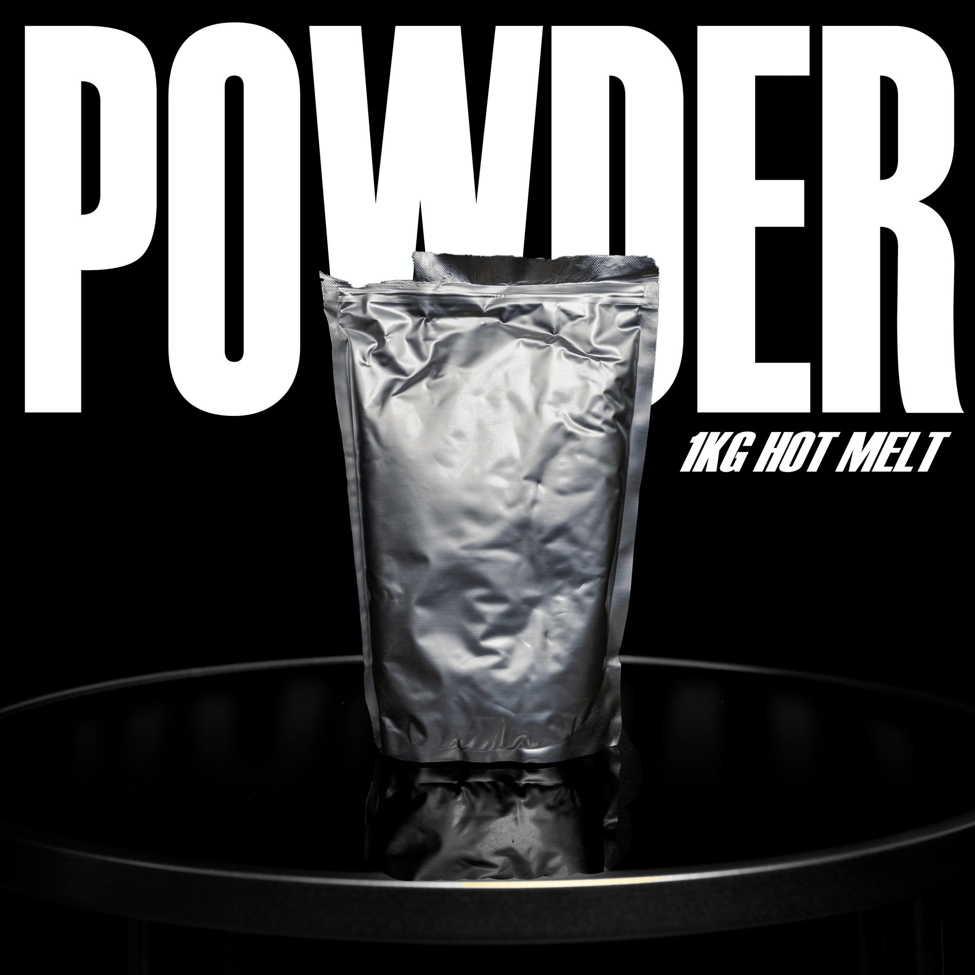 A silver foil bag stands upright on a glossy black surface. "POWDER" is prominently displayed in large white letters above it, with "1KG HOT MELT" in smaller text to the right. This 1kg Hot Melt DTF Powder by DTF Locker ensures vibrant color retention and maximum adhesion against a black background.